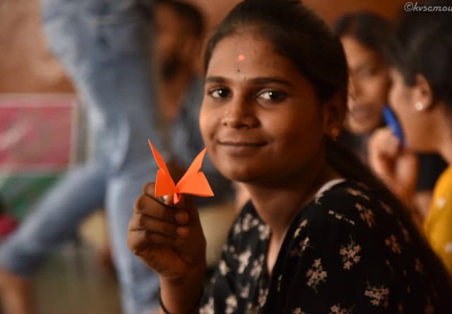 Girl holding origami